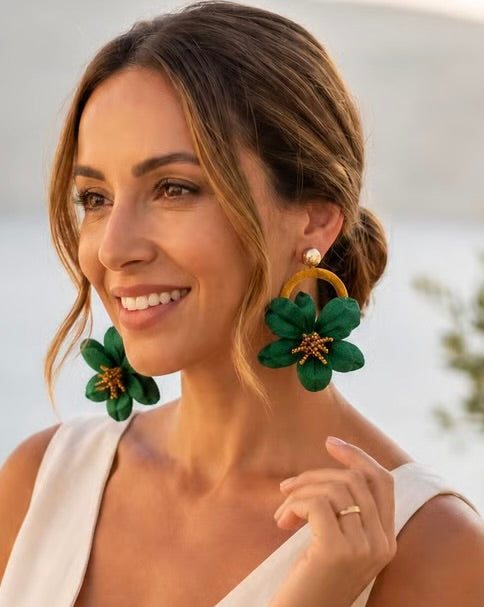 Artisan earrings with emerald bloom design
